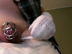 diapered sissy schoolgirl in dripping diapers and chastity cage trying to cum